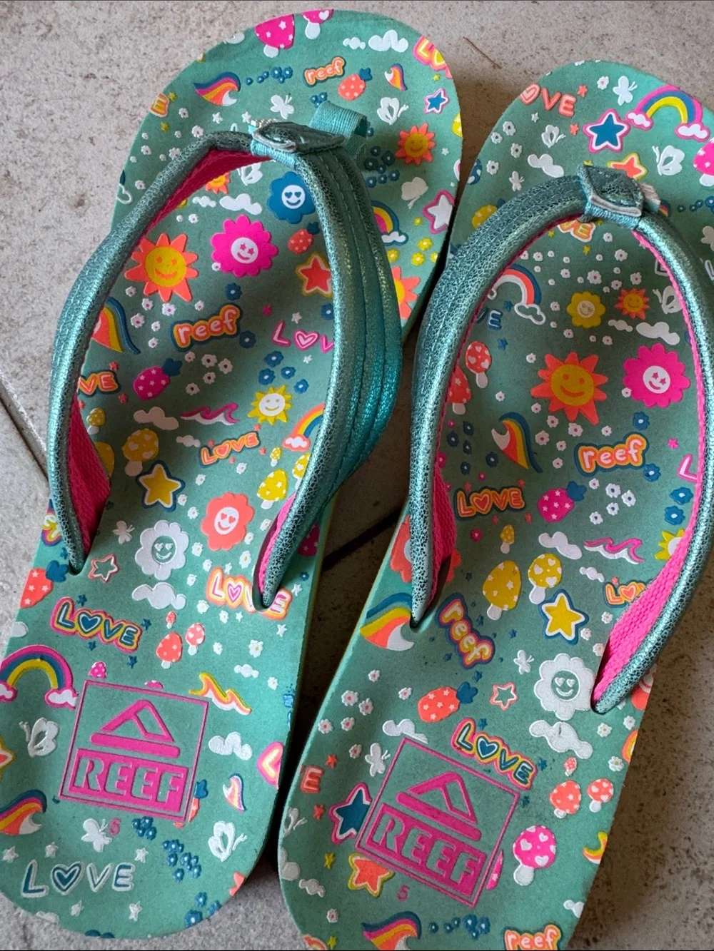 Reef Big Girls Teal Rainbow Print Flip Flops with Pink Accents